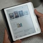 A person holding a tablet with a page on it